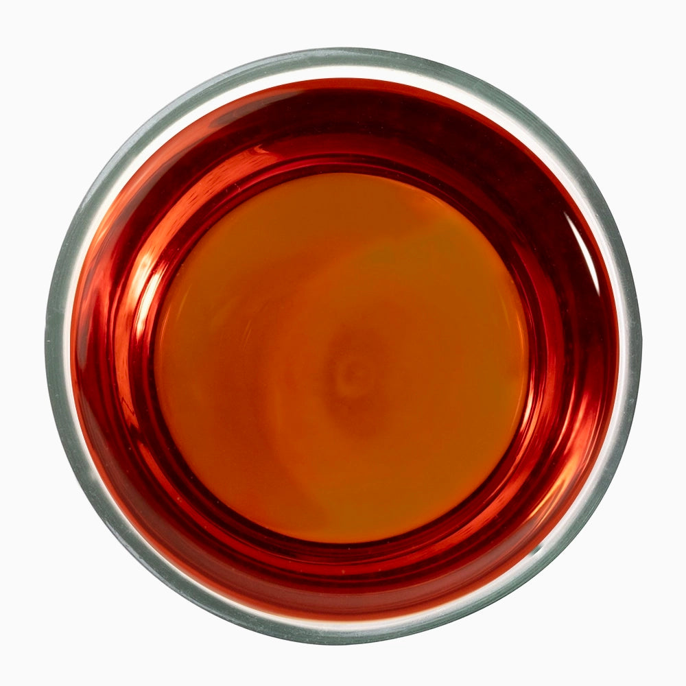 Dark orange shaded tea liquid in metal bowl — iconic of surianalle sequel.